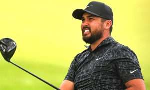 Jason Day playing golf while enjoying a mass net worth and extensive career earnings